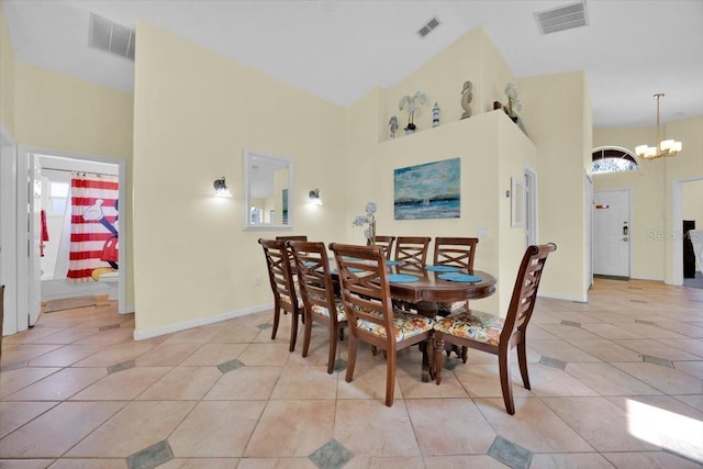 2627 Autumn Creek Cir, Kissimmee, FL 34747 - dining room with light tile patterned floors, a high ceiling, a chandelier, and baseboards
