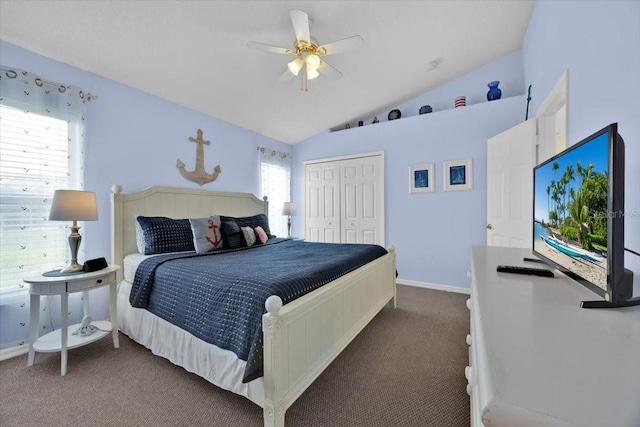 2627 Autumn Creek Cir, Kissimmee, FL 34747 - bedroom featuring dark carpet, a closet, lofted ceiling, and a ceiling fan