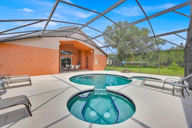 2627 Autumn Creek Cir, Kissimmee, FL 34747 - view of pool with a pool with connected hot tub, a patio, and glass enclosure