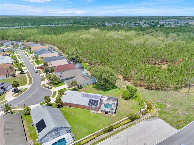 2627 Autumn Creek Cir, Kissimmee, FL 34747 - aerial view of property and surrounding area featuring a heavily wooded area and nearby suburban area
