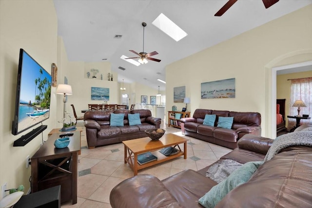 2627 Autumn Creek Cir, Kissimmee, FL 34747 - living area with a ceiling fan, light tile patterned flooring, high vaulted ceiling, and a skylight