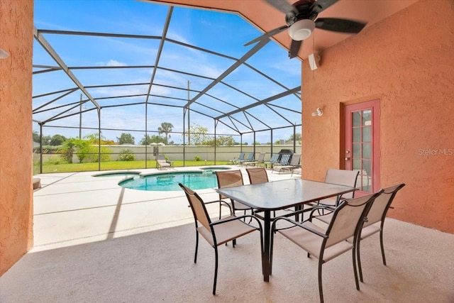 2627 Autumn Creek Cir, Kissimmee, FL 34747 - view of patio / terrace with ceiling fan, an outdoor pool, an in-ground hot tub, and glass enclosure