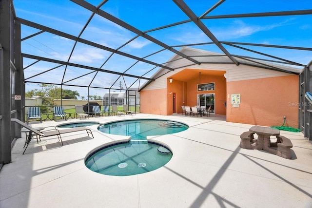 2627 Autumn Creek Cir, Kissimmee, FL 34747 - view of swimming pool with a pool with connected hot tub, a patio area, and a lanai