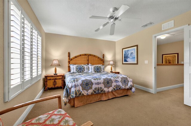 3725 Calabria Ave, Davenport, FL 33897 - bedroom featuring carpet flooring, multiple windows, baseboards, and a textured ceiling