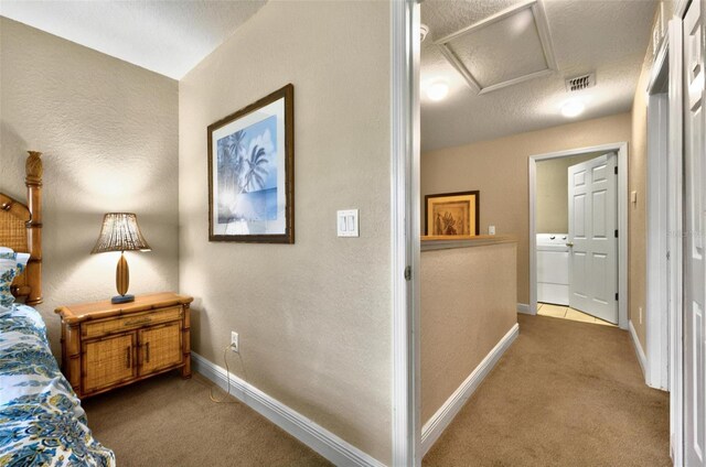 3725 Calabria Ave, Davenport, FL 33897 - corridor with washer / clothes dryer, carpet, attic access, and baseboards