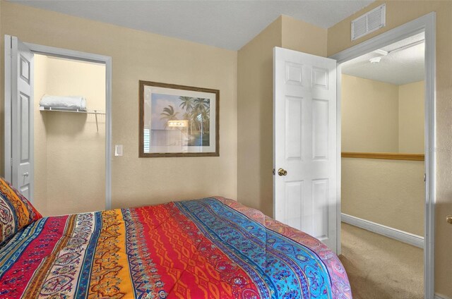 3725 Calabria Ave, Davenport, FL 33897 - bedroom with carpet flooring, a closet, and baseboards