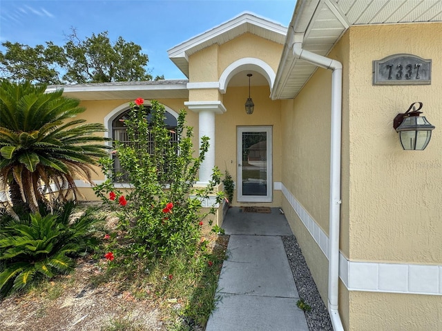 7337 Cone Shell Dr, Spring Hill, FL 34607 - view of exterior entry featuring stucco siding