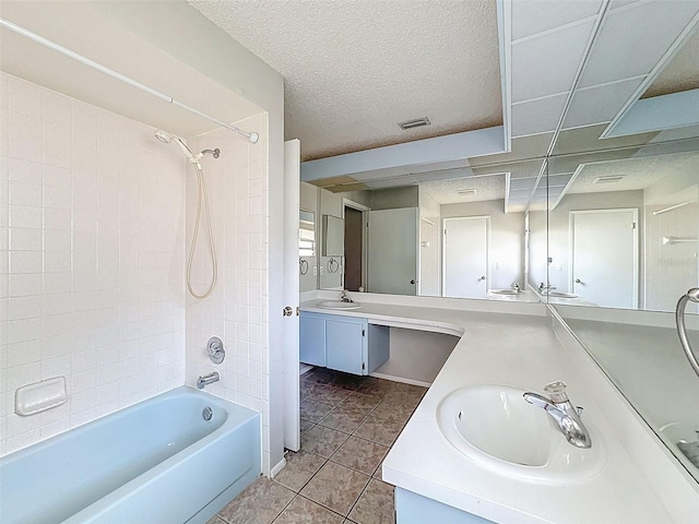 7337 Cone Shell Dr, Spring Hill, FL 34607 - bathroom with tile patterned flooring, shower / washtub combination, vanity, and a textured ceiling