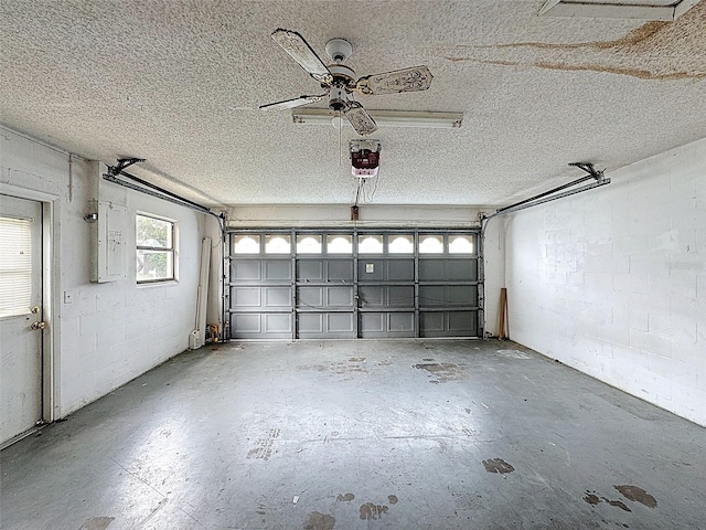 7337 Cone Shell Dr, Spring Hill, FL 34607 - garage featuring a garage door opener, electric panel, and concrete block wall
