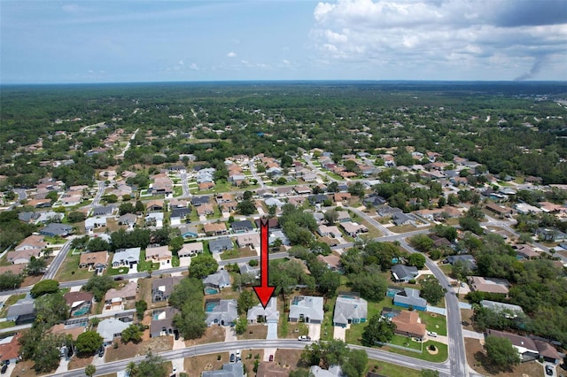 7337 Cone Shell Dr, Spring Hill, FL 34607 - aerial view of property and surrounding area with nearby suburban area and a heavily wooded area