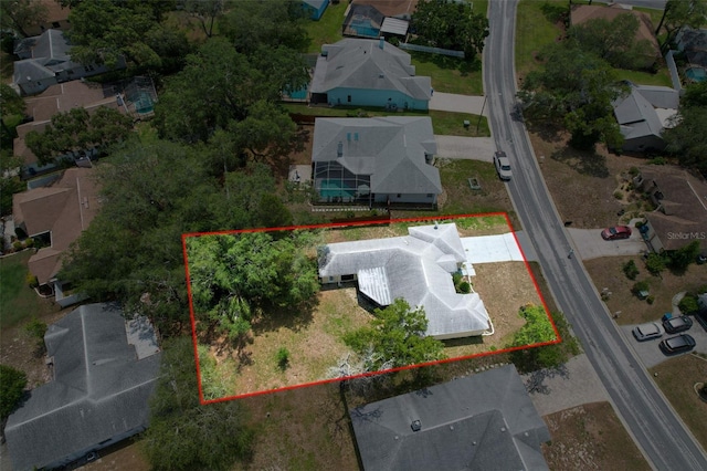 7337 Cone Shell Dr, Spring Hill, FL 34607 - aerial perspective of suburban area featuring property boundaries highlighted