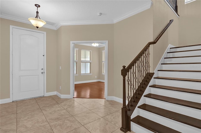8348 Vivaro Isle Way, Windermere, FL 34786 - foyer featuring crown molding, stairs, light tile patterned floors, and baseboards
