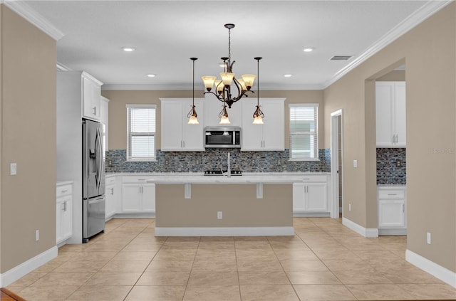 8348 Vivaro Isle Way, Windermere, FL 34786 - kitchen with appliances with stainless steel finishes, decorative backsplash, crown molding, light countertops, and a chandelier