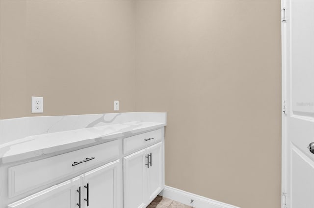 8348 Vivaro Isle Way, Windermere, FL 34786 - bathroom with tile patterned floors, vanity, and baseboards
