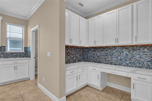 8348 Vivaro Isle Way, Windermere, FL 34786 - kitchen featuring crown molding, light tile patterned flooring, light stone counters, white cabinets, and decorative backsplash