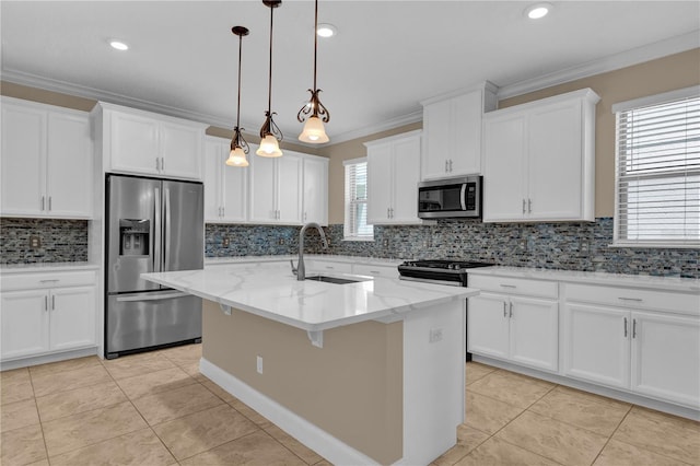 8348 Vivaro Isle Way, Windermere, FL 34786 - kitchen with stainless steel appliances, a sink, backsplash, white cabinetry, and a center island with sink
