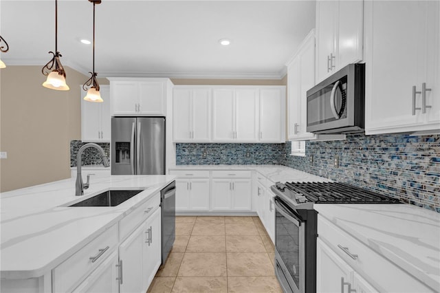 8348 Vivaro Isle Way, Windermere, FL 34786 - kitchen with appliances with stainless steel finishes, a sink, decorative backsplash, crown molding, and white cabinets
