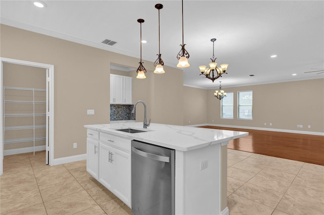 8348 Vivaro Isle Way, Windermere, FL 34786 - kitchen with stainless steel dishwasher, a sink, crown molding, an island with sink, and light tile patterned floors