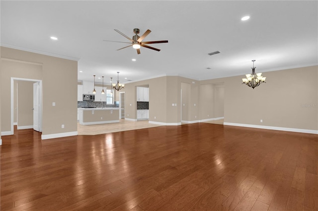 8348 Vivaro Isle Way, Windermere, FL 34786 - unfurnished living room featuring a chandelier, light wood-style floors, recessed lighting, a ceiling fan, and baseboards