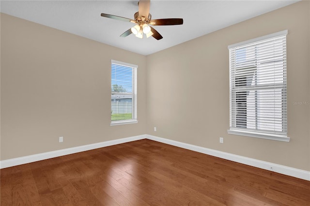 8348 Vivaro Isle Way, Windermere, FL 34786 - spare room featuring wood finished floors, baseboards, and ceiling fan