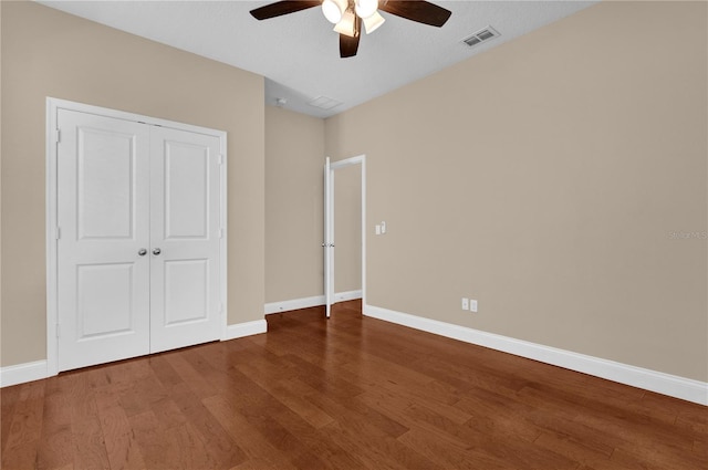 8348 Vivaro Isle Way, Windermere, FL 34786 - unfurnished bedroom featuring wood finished floors, baseboards, a closet, and ceiling fan