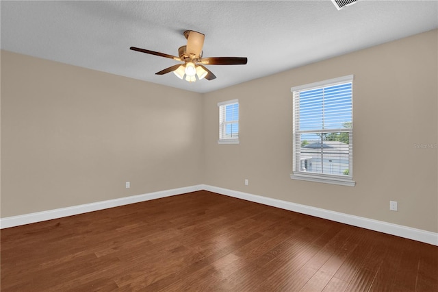 8348 Vivaro Isle Way, Windermere, FL 34786 - empty room with baseboards, dark wood-style flooring, and ceiling fan