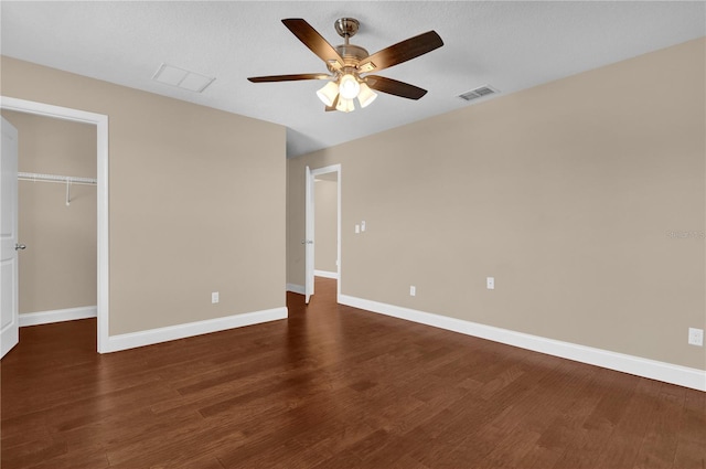 8348 Vivaro Isle Way, Windermere, FL 34786 - unfurnished bedroom featuring dark wood-style flooring, baseboards, and ceiling fan