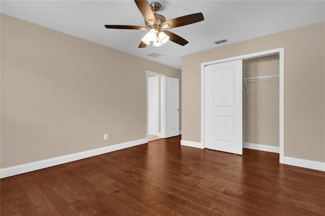 8348 Vivaro Isle Way, Windermere, FL 34786 - unfurnished bedroom with baseboards, wood finished floors, a closet, and a ceiling fan