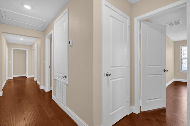 8348 Vivaro Isle Way, Windermere, FL 34786 - hallway with dark wood-style floors, baseboards, and attic access