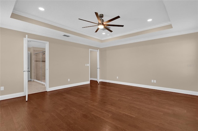 8348 Vivaro Isle Way, Windermere, FL 34786 - unfurnished bedroom featuring a raised ceiling, dark wood-type flooring, crown molding, baseboards, and recessed lighting