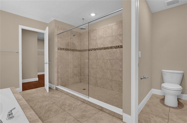 8348 Vivaro Isle Way, Windermere, FL 34786 - full bathroom with a stall shower, a spacious closet, toilet, a garden tub, and tile patterned floors