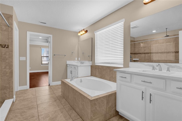 8348 Vivaro Isle Way, Windermere, FL 34786 - full bath featuring two vanities, tiled shower, a bath, and tile patterned floors