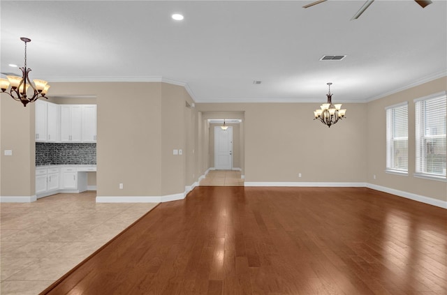 8348 Vivaro Isle Way, Windermere, FL 34786 - unfurnished living room with a chandelier, light wood-style flooring, crown molding, baseboards, and recessed lighting