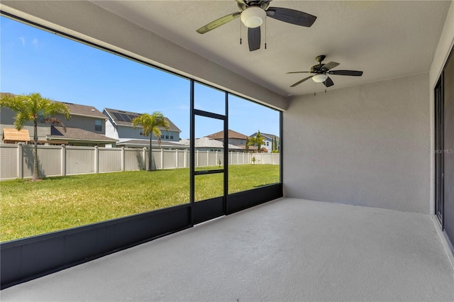 8348 Vivaro Isle Way, Windermere, FL 34786 - unfurnished sunroom with a ceiling fan and a residential view