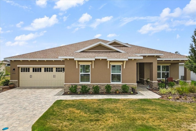9846 SW 106th Ct, Ocala, F, Ocala, FL 34481 - view of front of property with stone siding, stucco siding, decorative driveway, a garage, and roof with shingles