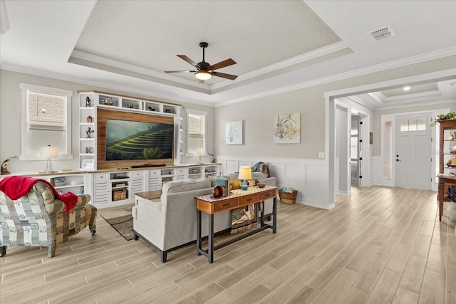 9846 SW 106th Ct, Ocala, F, Ocala, FL 34481 - living area with a raised ceiling, a ceiling fan, light wood-type flooring, ornamental molding, and a wainscoted wall