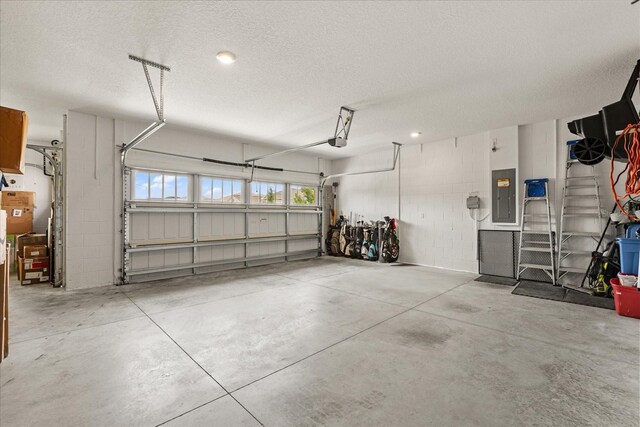 9846 SW 106th Ct, Ocala, F, Ocala, FL 34481 - garage with electric panel, concrete block wall, and a garage door opener