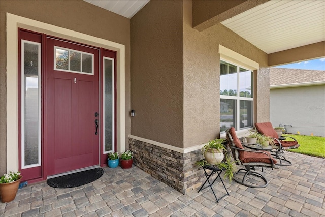 9846 SW 106th Ct, Ocala, F, Ocala, FL 34481 - view of exterior entry featuring stucco siding and stone siding