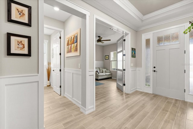 9846 SW 106th Ct, Ocala, F, Ocala, FL 34481 - foyer featuring a decorative wall, light wood-type flooring, wainscoting, ornamental molding, and ceiling fan