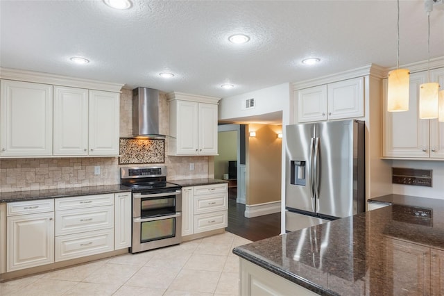 120 E Greentree Ln, Lake Mary, FL 32746 - kitchen with appliances with stainless steel finishes, wall chimney range hood, tasteful backsplash, dark stone countertops, and pendant lighting