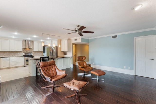 120 E Greentree Ln, Lake Mary, FL 32746 - living room featuring ceiling fan, wood-type flooring, baseboards, and crown molding