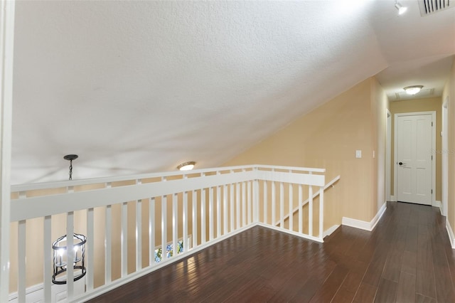 120 E Greentree Ln, Lake Mary, FL 32746 - hallway featuring baseboards, an upstairs landing, vaulted ceiling, and wood finished floors