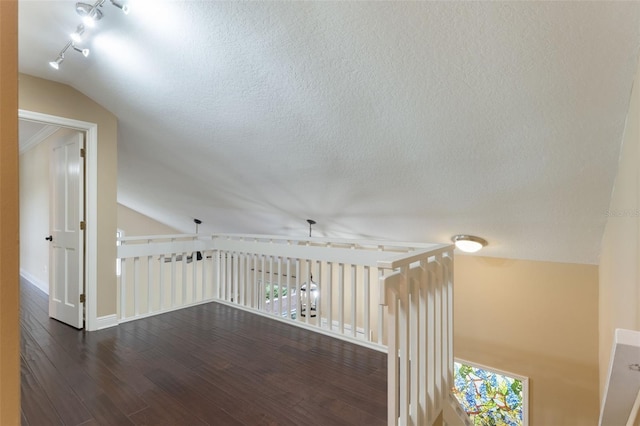 120 E Greentree Ln, Lake Mary, FL 32746 - corridor with lofted ceiling, wood finished floors, baseboards, and rail lighting