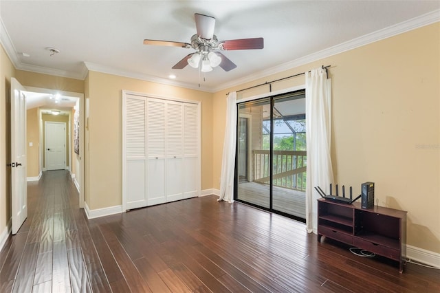 120 E Greentree Ln, Lake Mary, FL 32746 - unfurnished bedroom with access to exterior, baseboards, dark wood finished floors, ornamental molding, and a closet