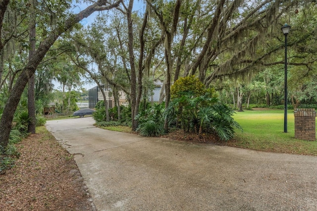120 E Greentree Ln, Lake Mary, FL 32746 - view of concrete surface featuring street lighting