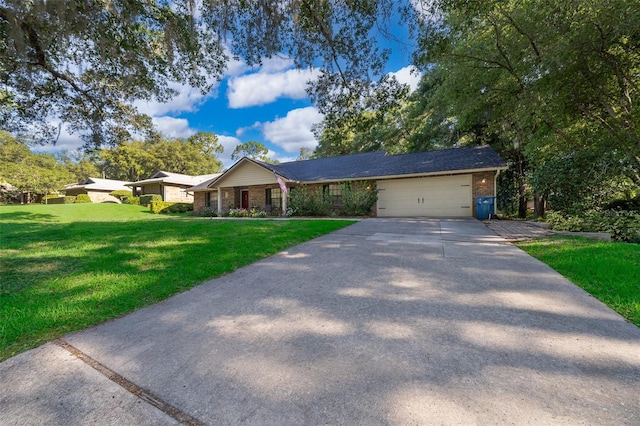 493 Princewood Dr, Deland, FL 32724 - ranch-style home with an attached garage, driveway, a front yard, and brick siding