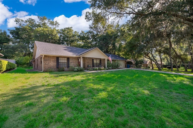 493 Princewood Dr, Deland, FL 32724 - ranch-style house featuring a front lawn and brick siding