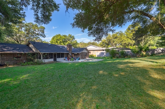 493 Princewood Dr, Deland, FL 32724 - view of yard featuring a sunroom and a patio area