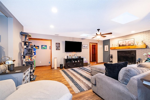 493 Princewood Dr, Deland, FL 32724 - living area featuring a skylight, baseboards, ceiling fan, light wood finished floors, and recessed lighting