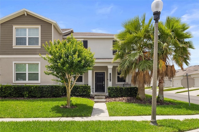 15096 Chapter Way, Winter Garden, FL 34787 - view of front of home with stucco siding and a front lawn